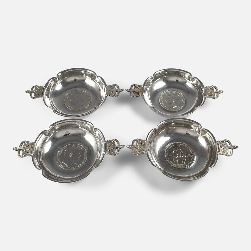 The set of 4 1950s silver coronation dishes,  viewed from above