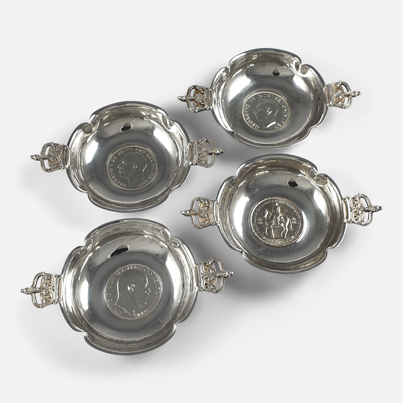 The set of 4 1950s silver coronation dishes,  viewed from above