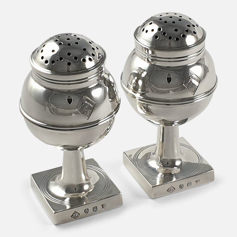 the silver pepper casters viewed at an angle