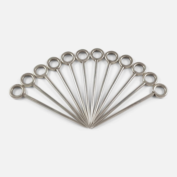 Set of 12 antique silver game or meat skewers, fanned out