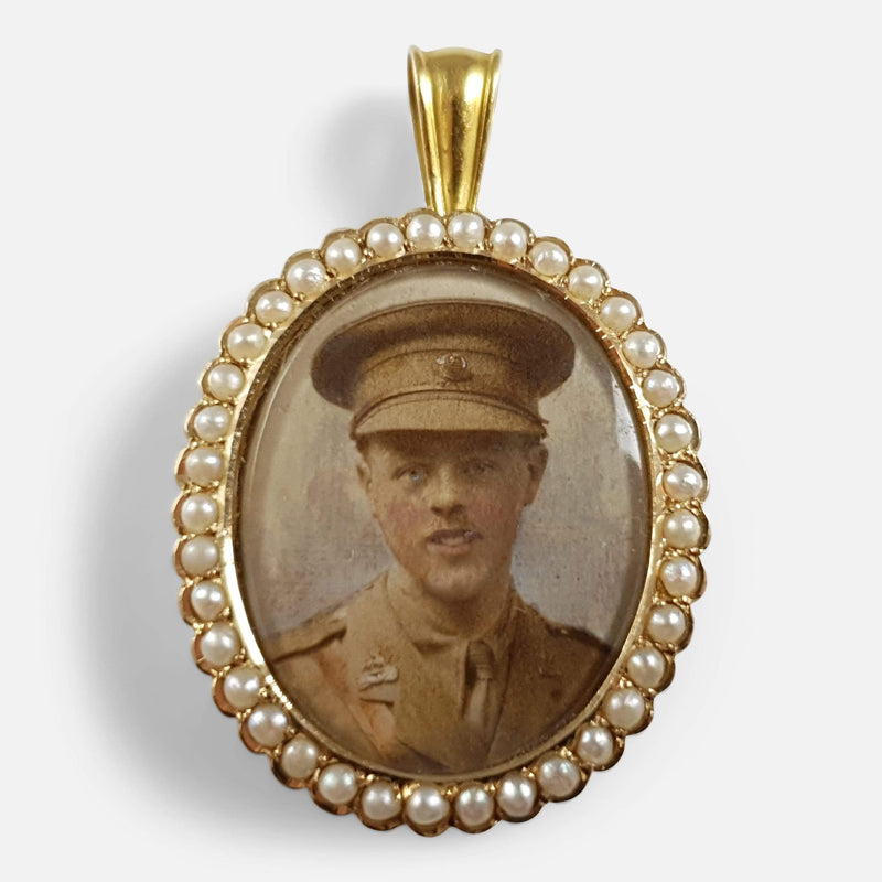 the 15ct yellow gold seed pearl locket with picture of man in military uniform viewed from the front