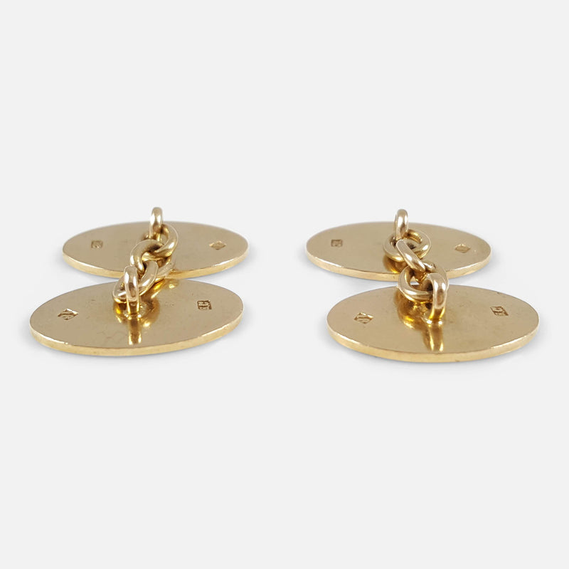 the backs of the cufflinks viewed side on