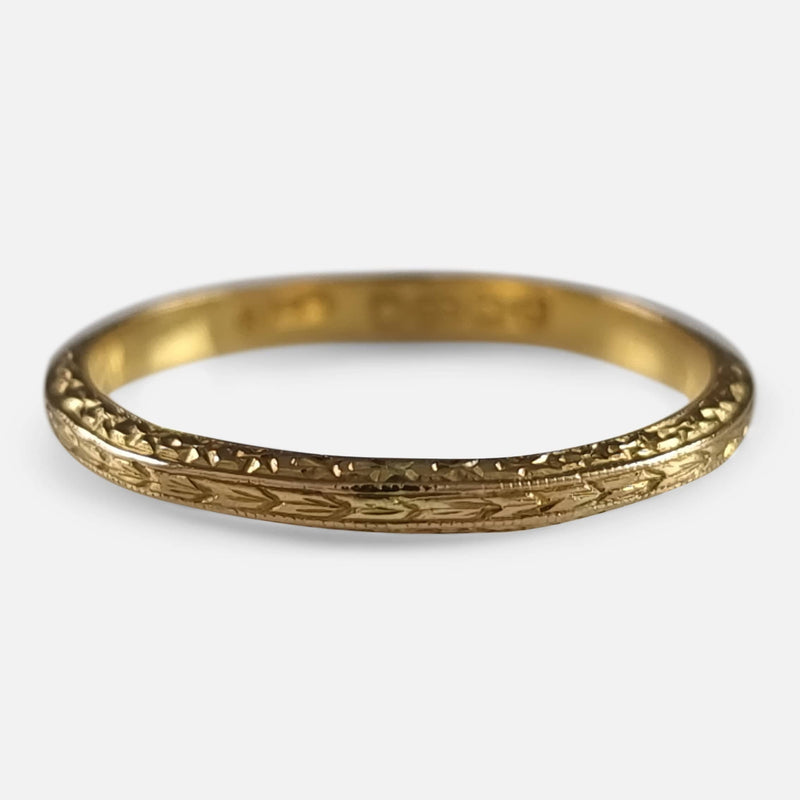 focused on the engraved decoration to the gold ring