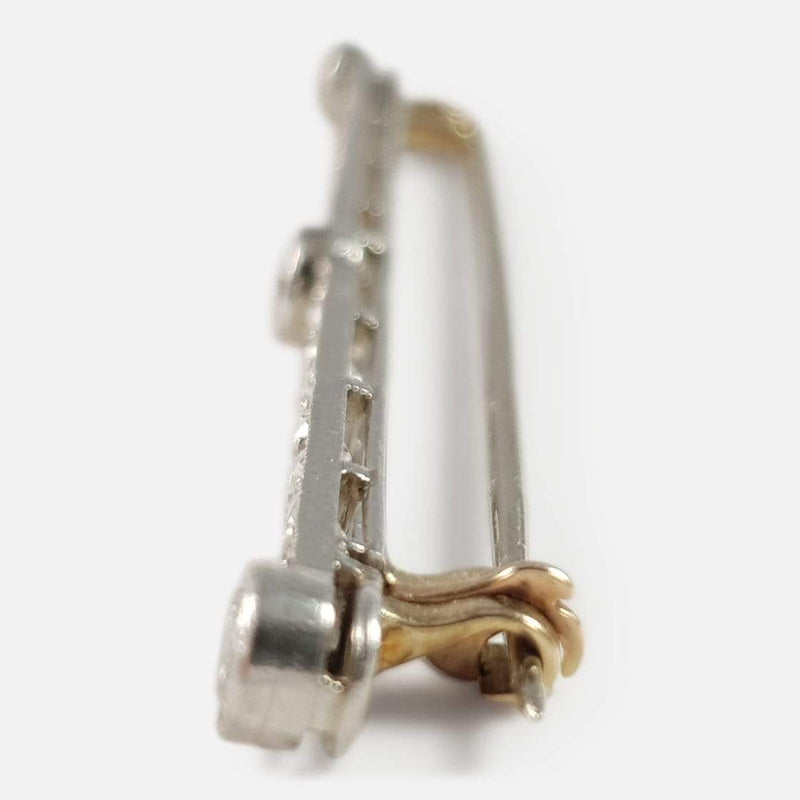 a side on view of the bar brooch with clasp in focus