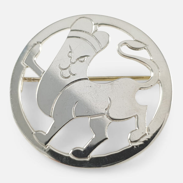 an Art Deco sterling silver lion brooch by H.G. Murphy, viewed from the front