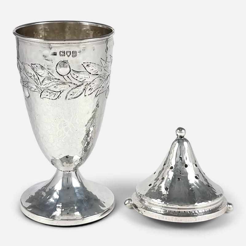 the sugar caster and lid placed side by side