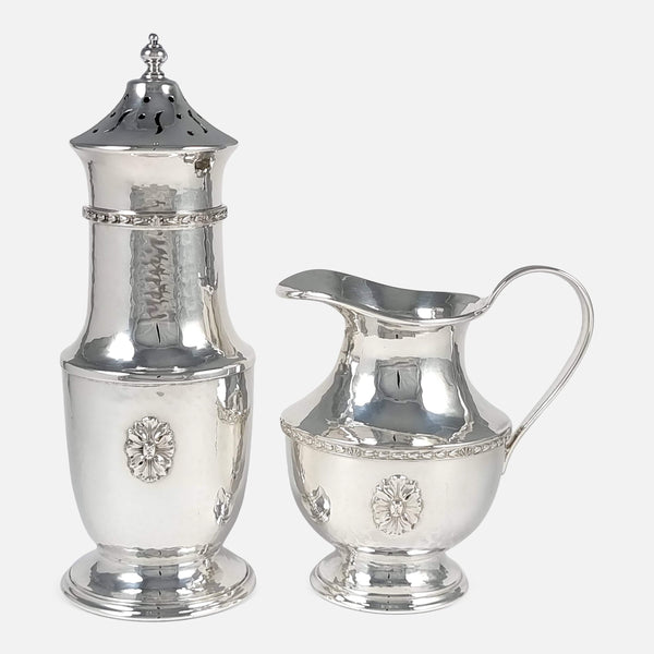 the sugar caster and cream jug side by side