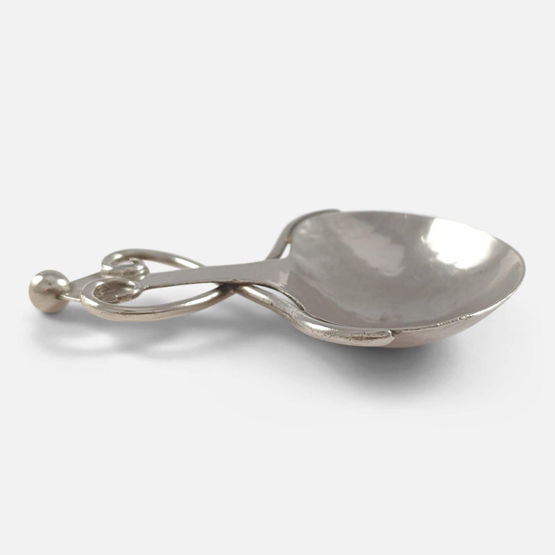 a side on view of the tea caddy spoon