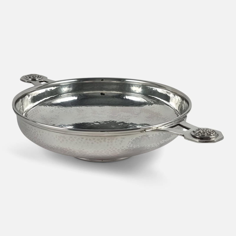 the Quaich viewed diagonally with one handle in the forefront pointing towards the right side
