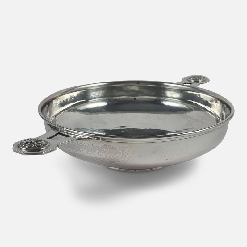 the Quaich viewed diagonally with one handle in the forefront pointing towards the left side
