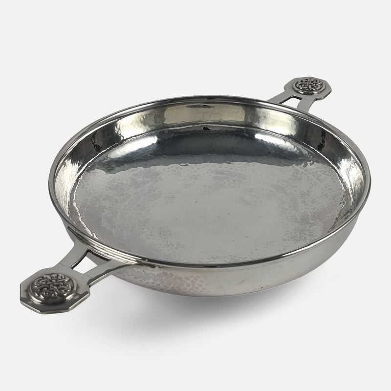the Quaich viewed diagonally with one handle in the forefront pointing towards the left side