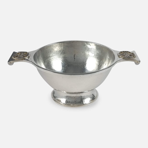 An Arts and Crafts sterling silver Quaich by Sibyl Dunlop, viewed from a slightly raised position