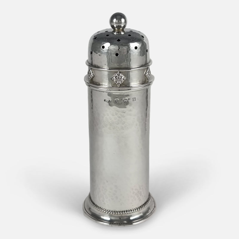 the silver sugar caster viewed with the hallmarks to the forefront