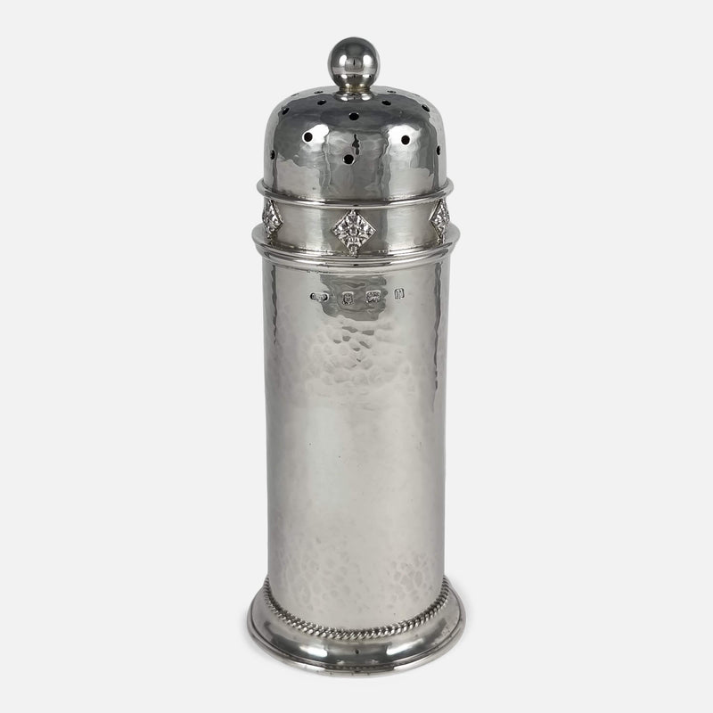 the Arts and Crafts sterling silver sugar caster viewed with hallmarks to the forefront
