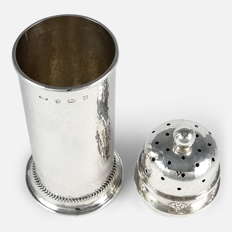 a birds eye view of the sugar caster with lid removed and placed side by side