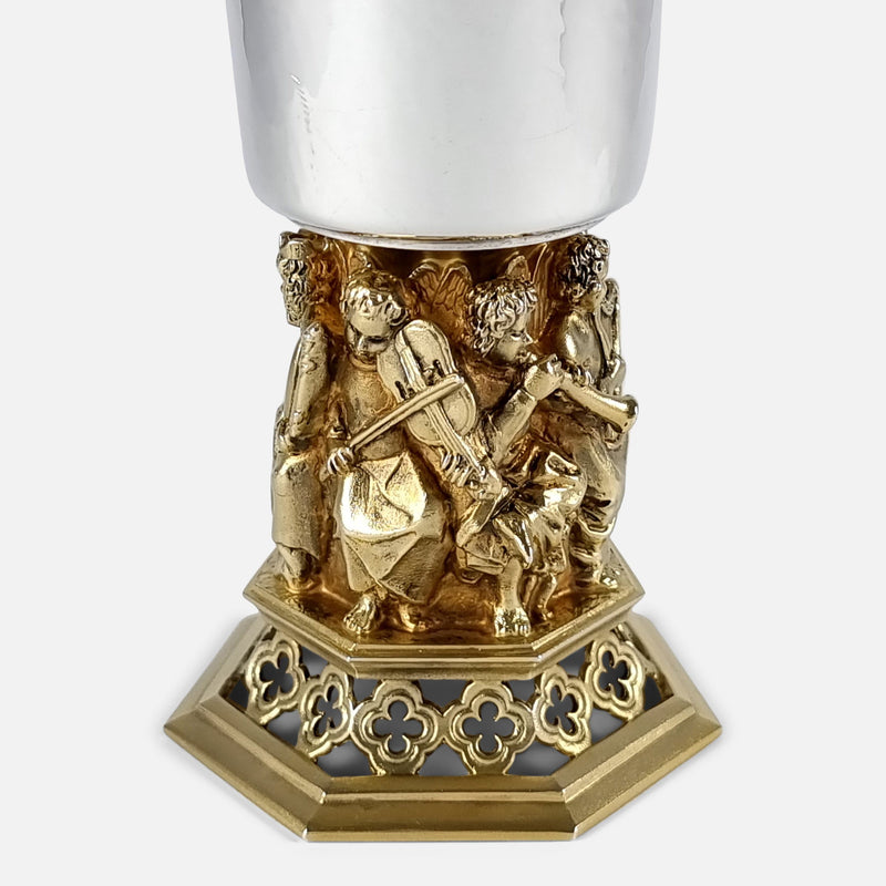 focused on the figures to one side of the goblet