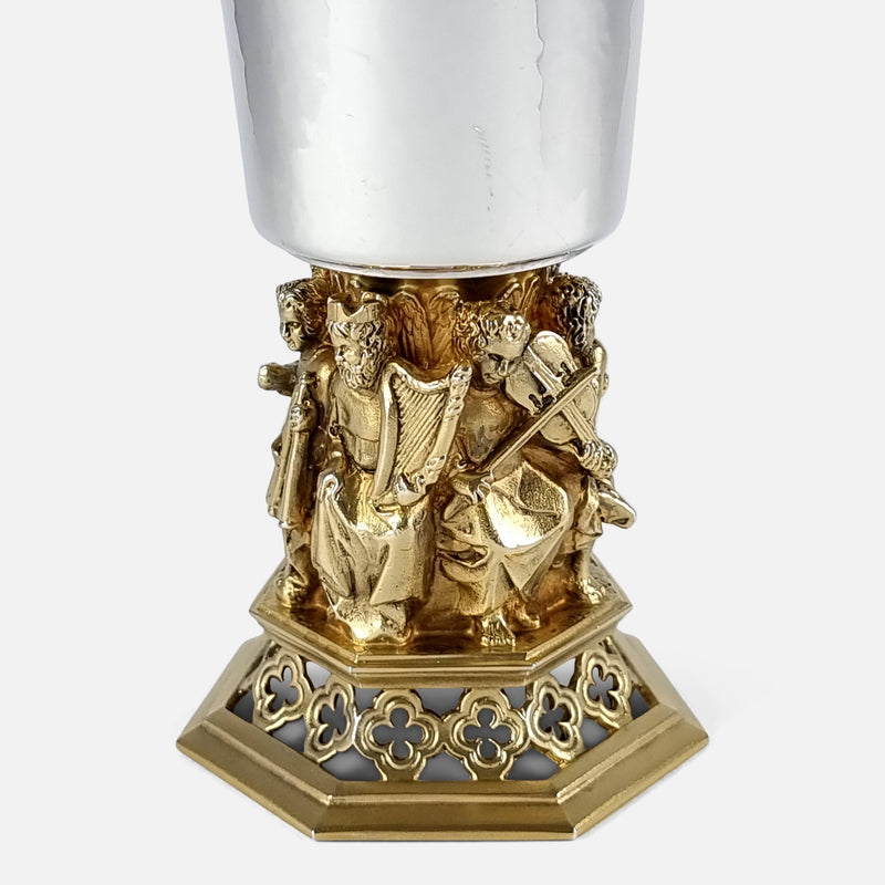 focused on the figures to one side of the goblet