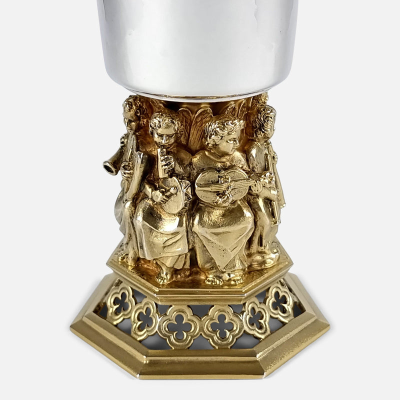 focused on the figures to one side of the goblet