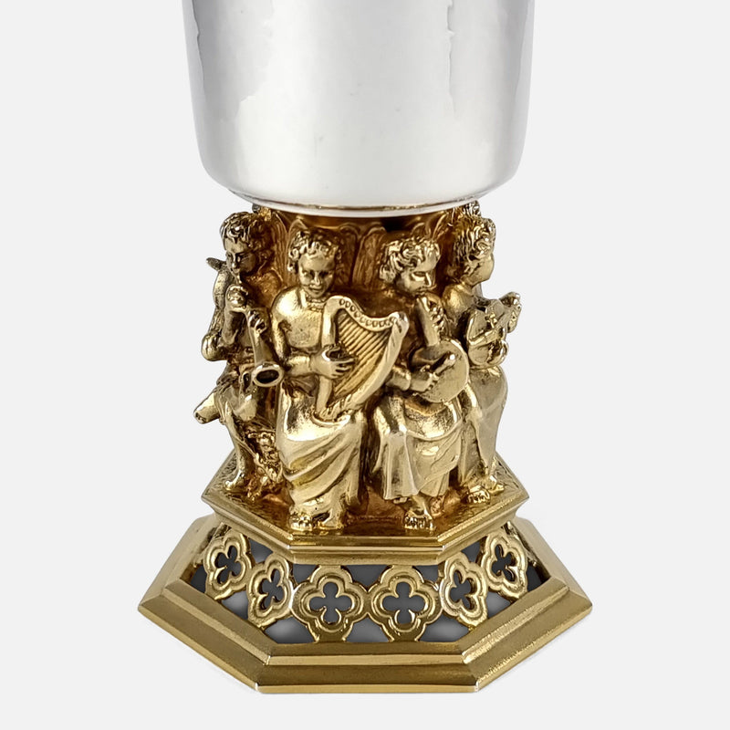 focused on the figures to one side of the goblet