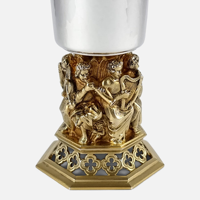 focused on the figures to one side of the goblet