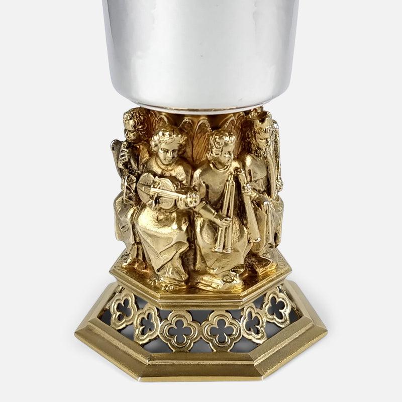 focused on the figures to one side of the goblet