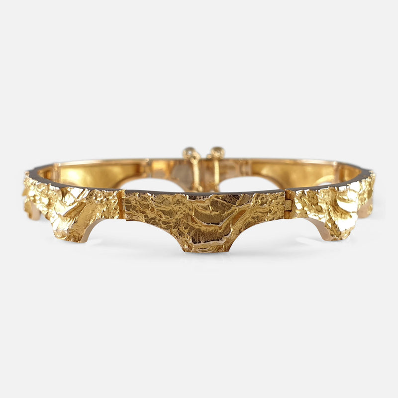 LOT:129 | PANDORA - a 14ct gold bracelet, with four charms.