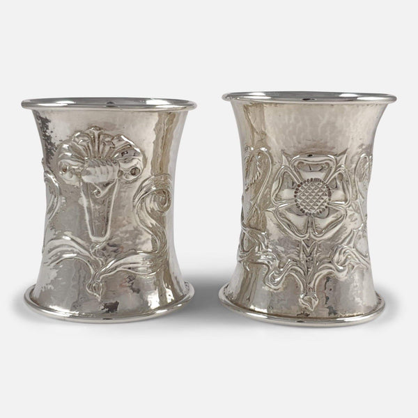 the pair of silver napkin rings with decoration in focus