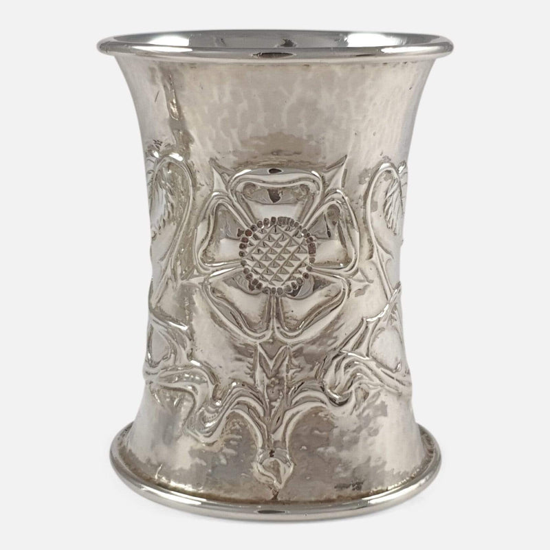 the napkin ring focused on its tudor rose decoration