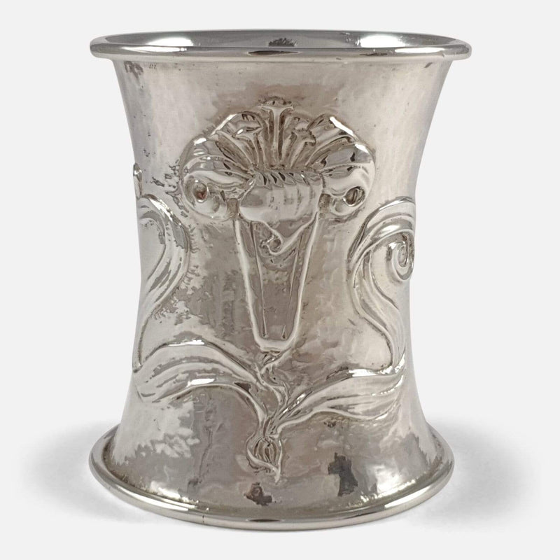 the napkin ring focused on its trumpet lily decoration