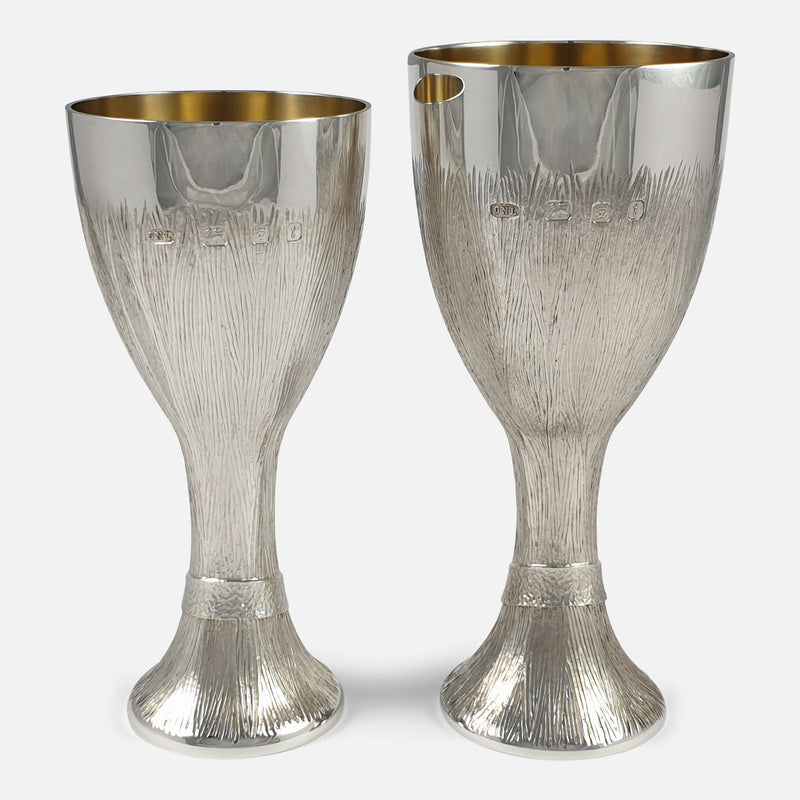 the two cups with hallmarks to the forefront