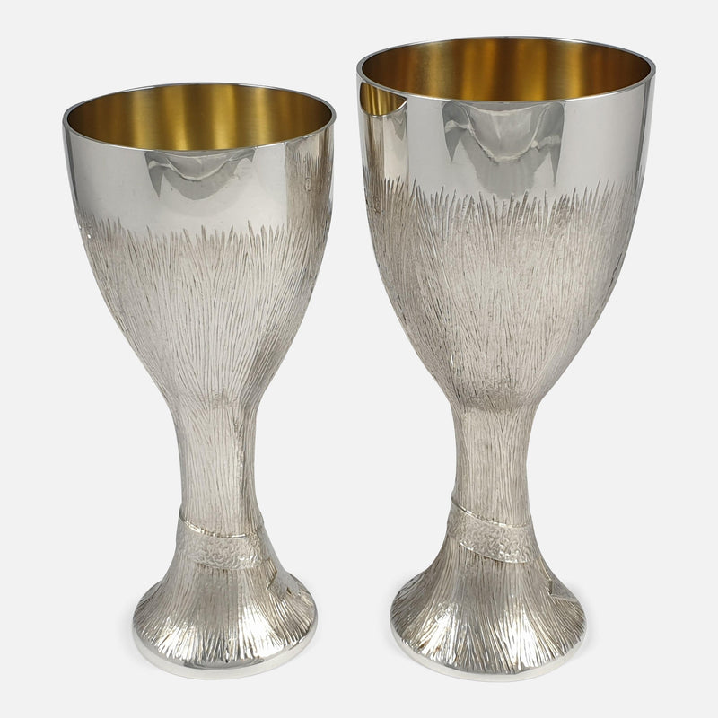 a side on view of both of the silver cups