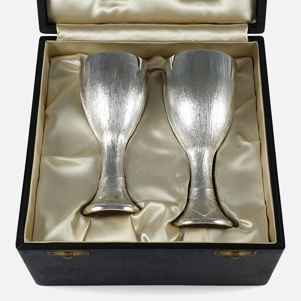 the sterling silver cups viewed in their case