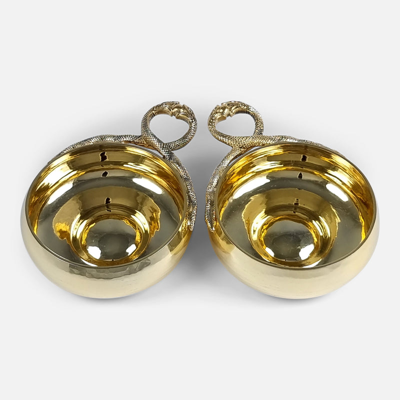 a birds eye view of the cups with handles in the background and handles pointing slightly towards each other