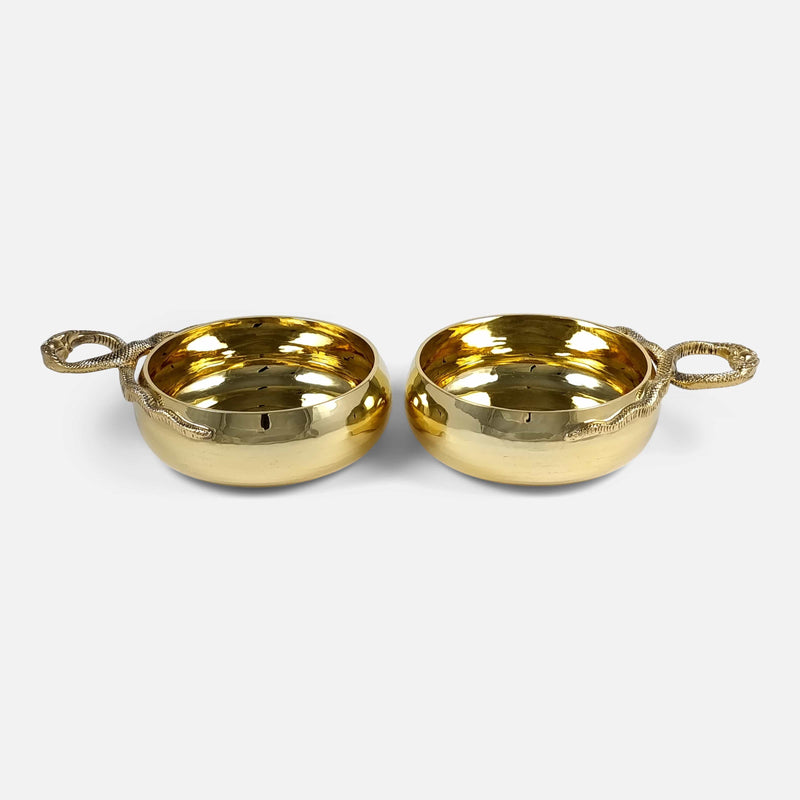 the cups viewed side on with handles pointing in opposite directions