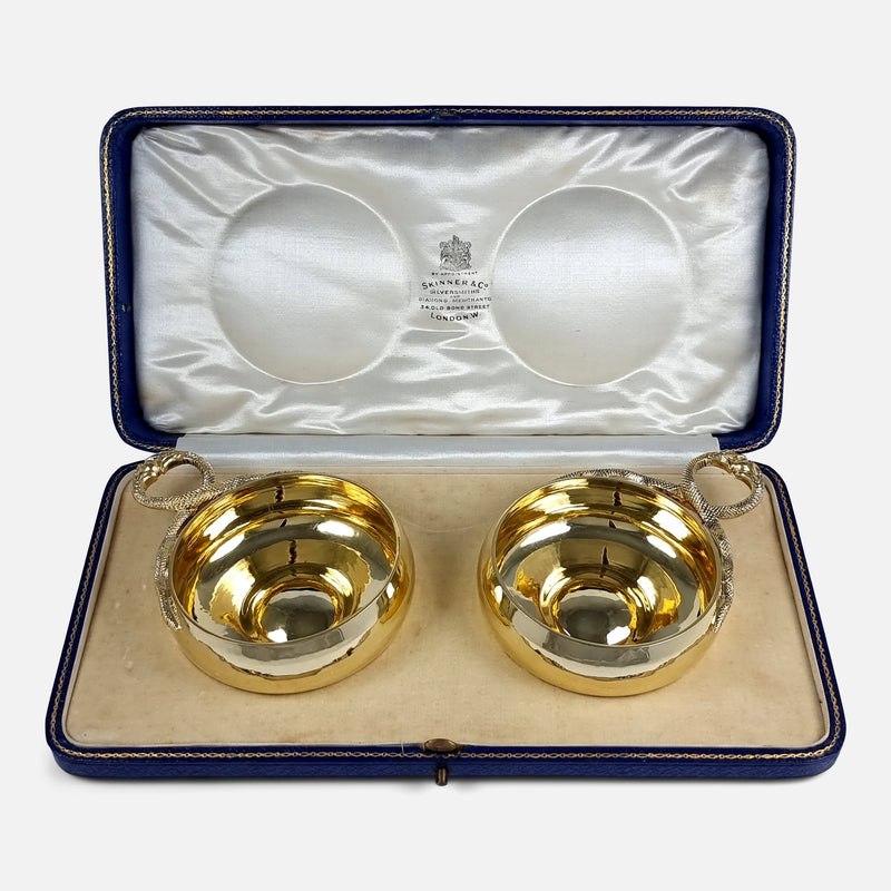 the pair of George V sterling silver-gilt wine tasters viewed in their case