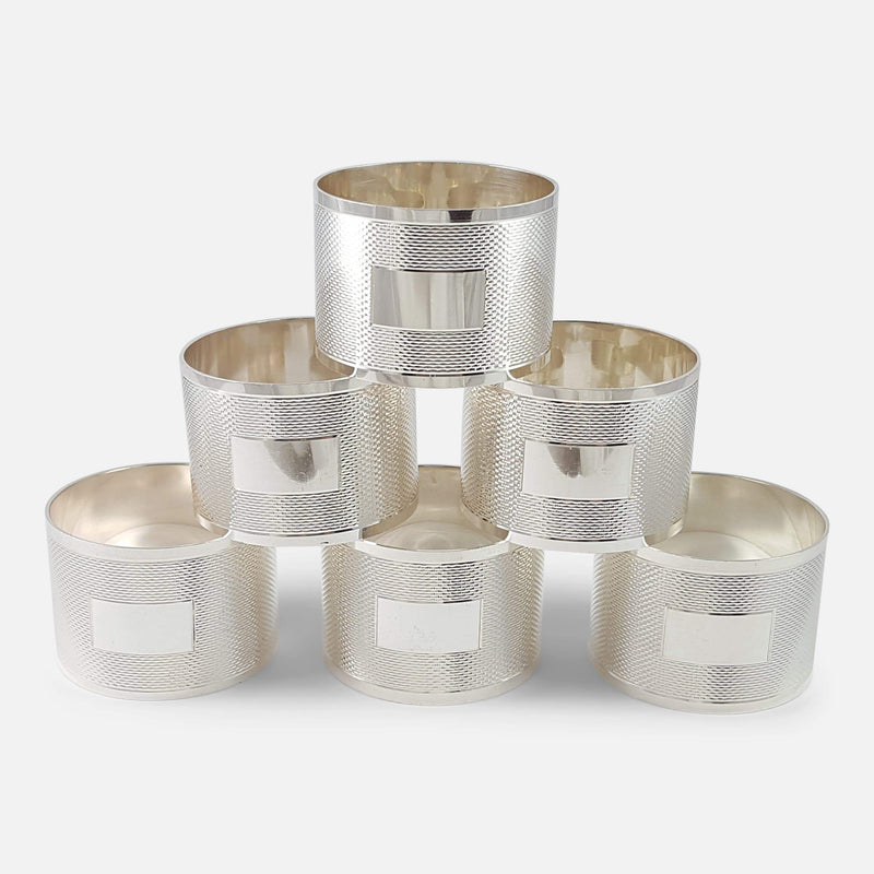 the set of 6 napkin rings stacked with cartouche to forefront