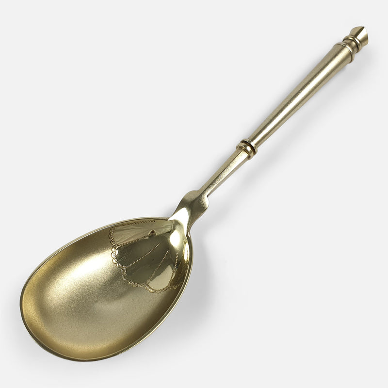 one of the serving spoons viewed diagonally with bowl to forefront