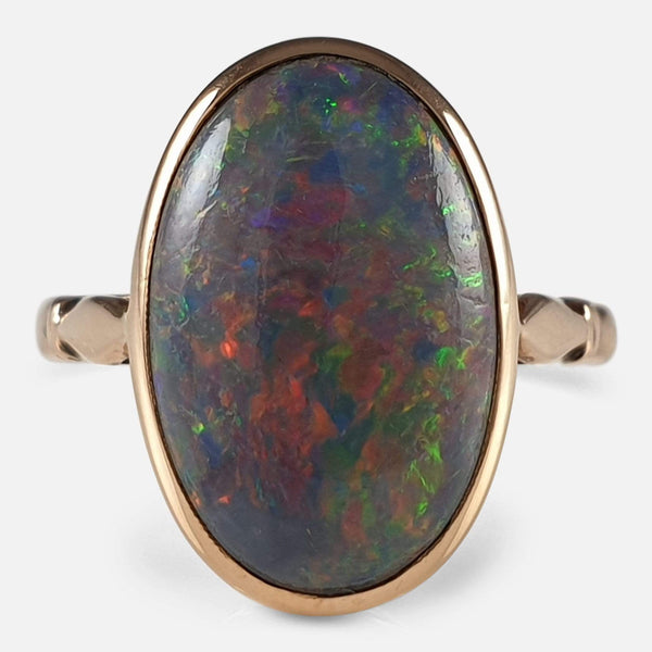the Early 20thC 15ct rose gold and black opal ring viewed from the front