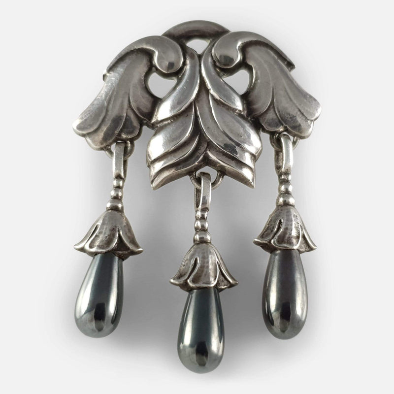 the silver brooch viewed from the front