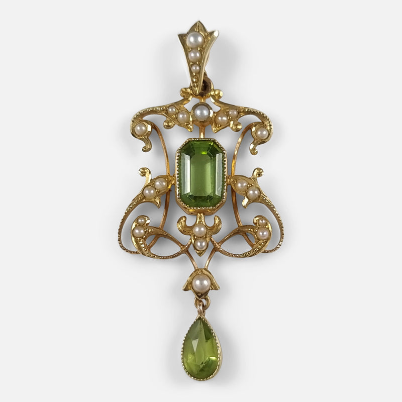 the Edwardian 15ct gold peridot and seed pearl pendant viewed from the front