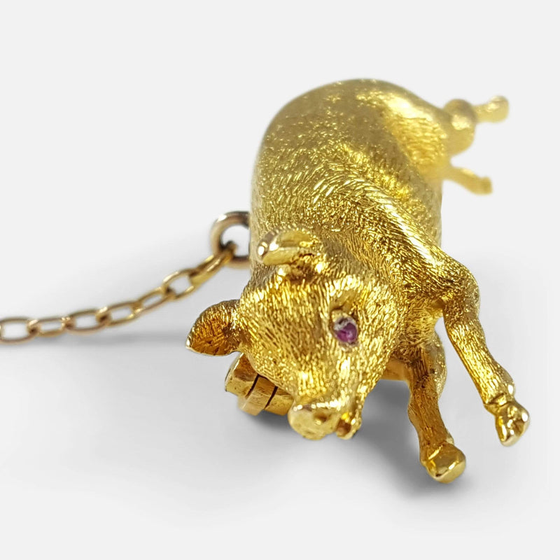 a side on view of the pig brooch with head in focus