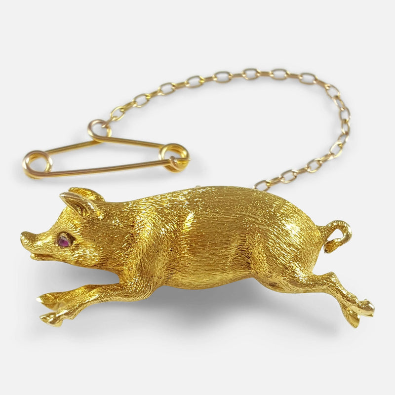 the Edwardian 15ct yellow gold pig brooch viewed from the front