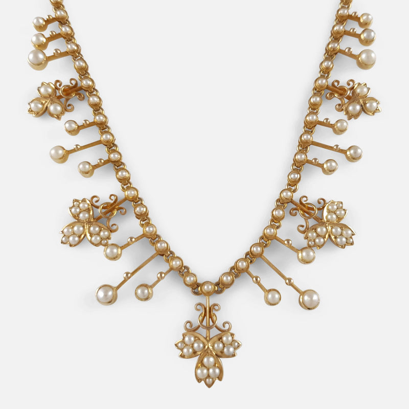 focused in on the seed pearl fringe and foliate section