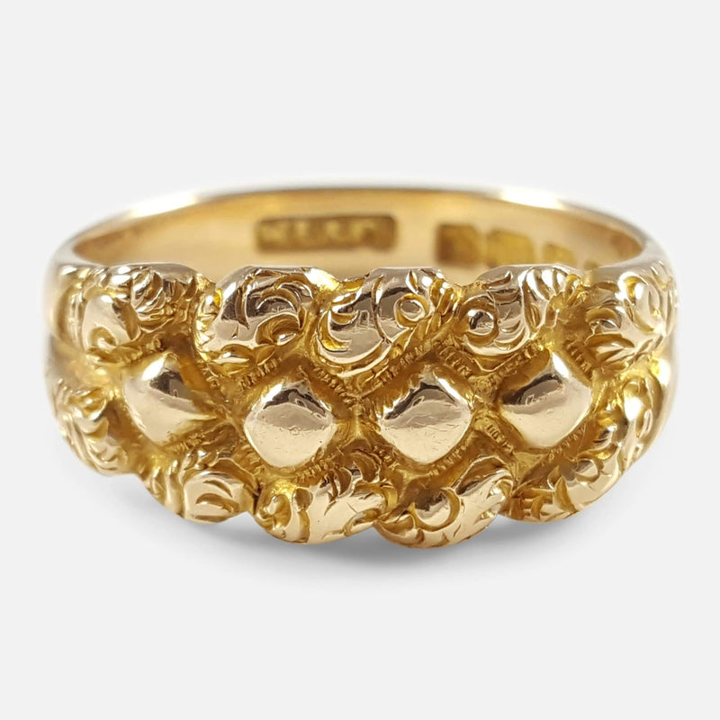 the Edwardian 18ct yellow gold engraved Keeper ring viewed from a slightly raised position