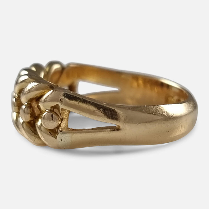 a side on view of the gold ring