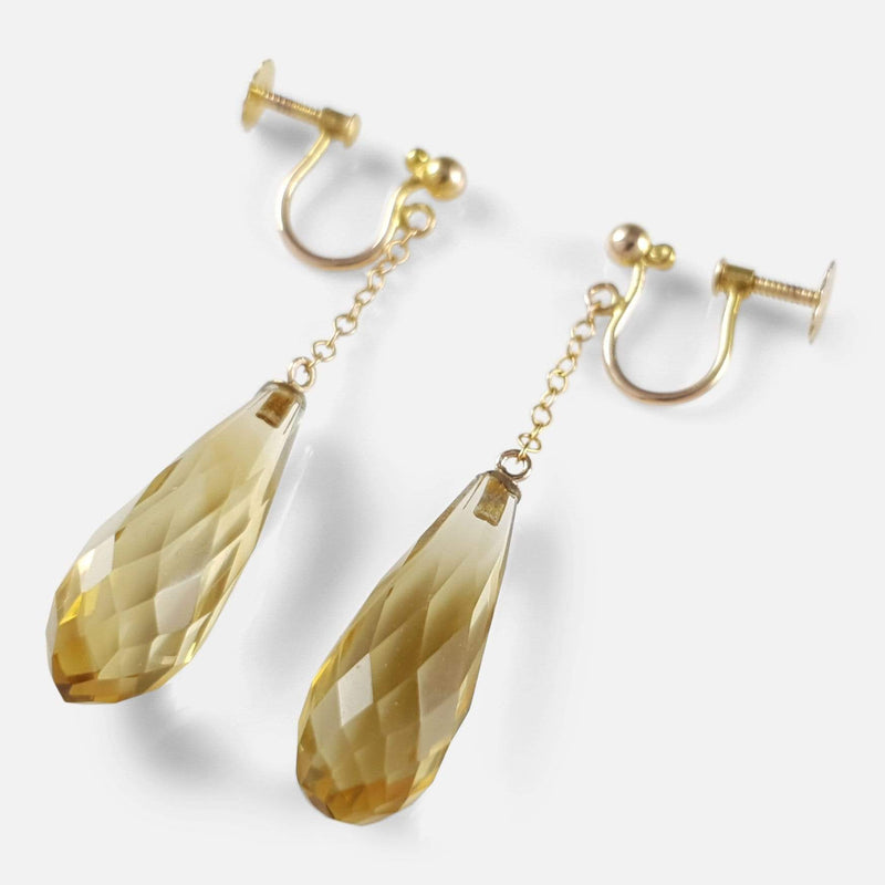 the earrings viewed diagonally with the briolette to the forefront
