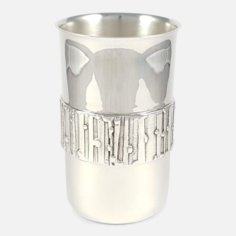 the silver beaker to include the decoration