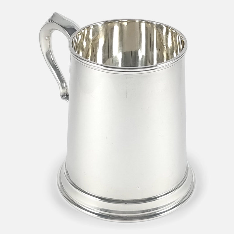 a view of the mug with handle in background pointing slightly towards the left