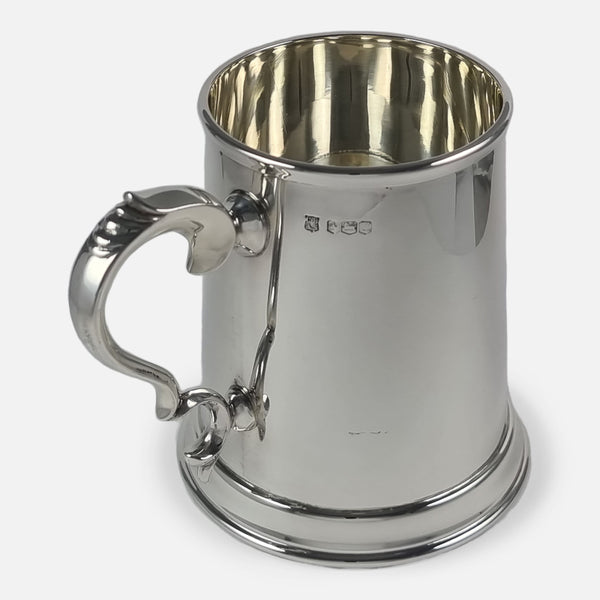the mug rotated with handle to forefront and pointing slightly towards the left