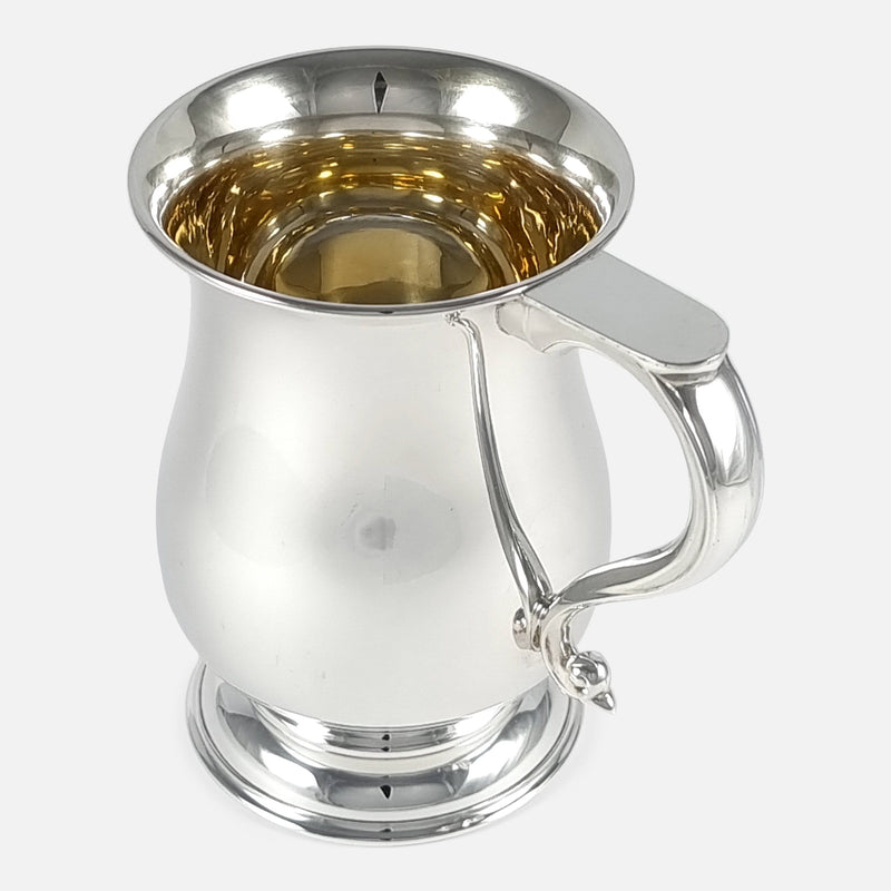 the mug with handle to the foreground and angled slightly towards the right